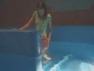 Thin mademoiselle mastrubating in pool